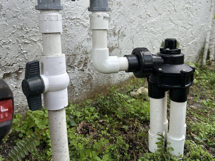 City water irrigation valves mounted at the side of a house