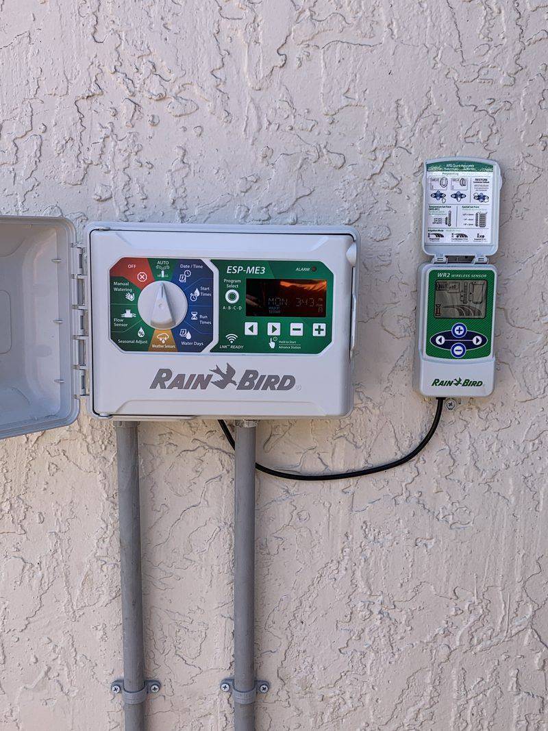 A Rain Bird smart irrigation controller with wireless rain sensor