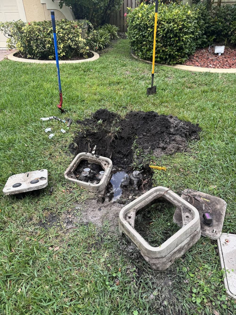 A city water meter box opened during irrigation service