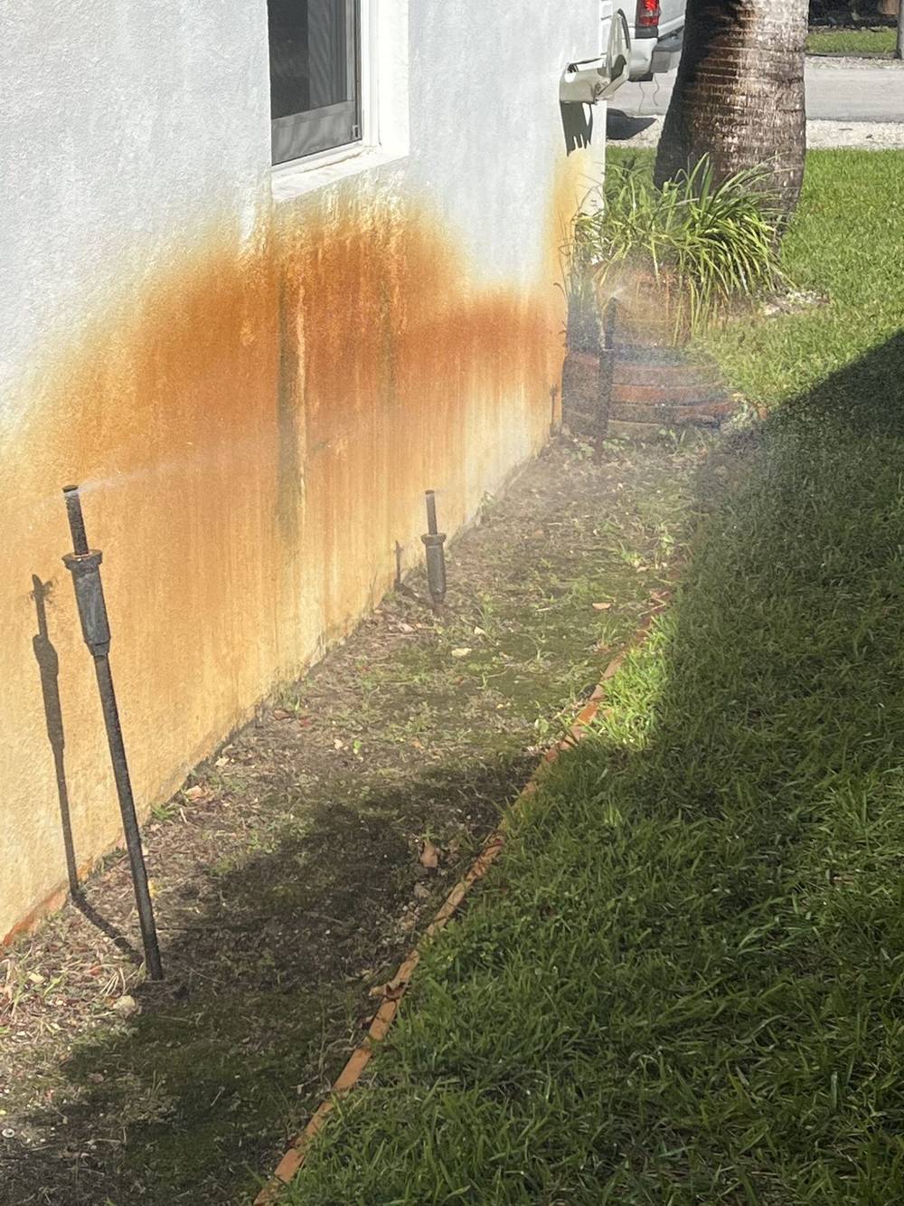 Iron staining from well water on a South Florida stucco wall